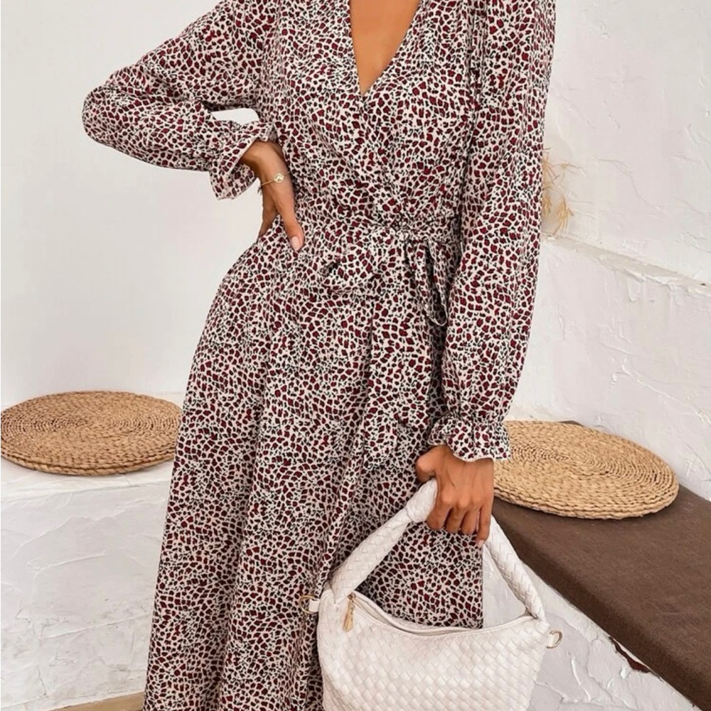 Allover print overlap collarfounce sleeve belted dress.